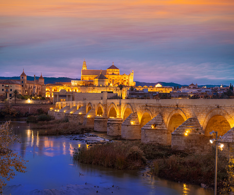 Cordoba roman bridge at sunset with mosque Cathedral in Andalusia of Spain