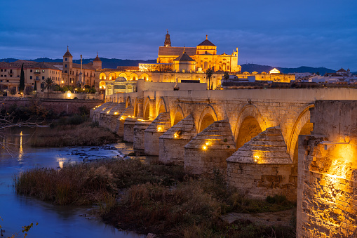 Cordoba roman bridge at sunset with mosque Cathedral in Andalusia of Spain