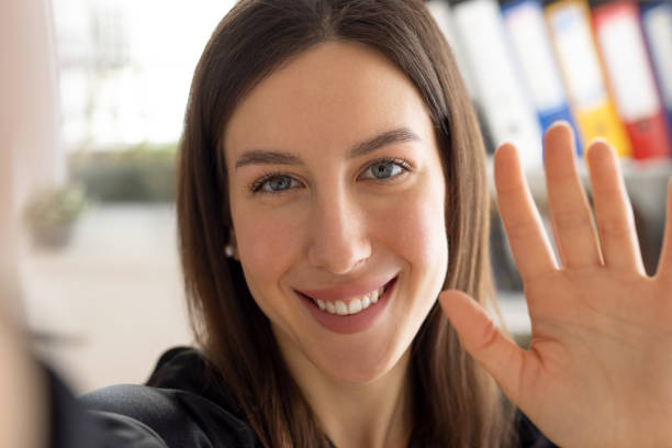 istock Woman taking a selfie at office 2111650670