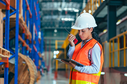 the worker is depicted amidst the organized chaos of a bustling warehouse, engaged in tasks such as inventory management, order fulfillment, or logistical operations.