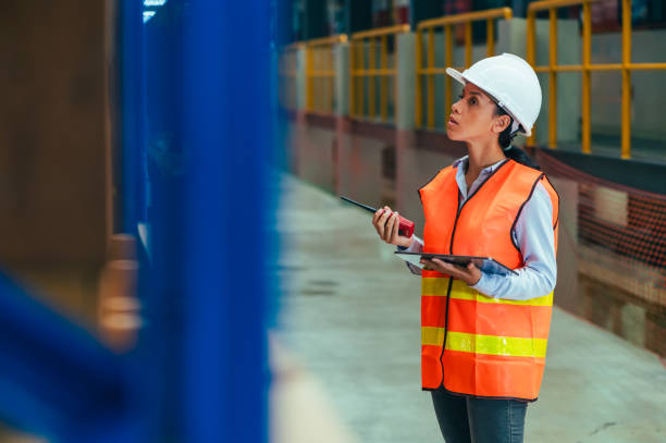 istock the worker is depicted amidst the organized chaos of a bustling warehouse, engaged in tasks such as inventory management, order fulfillment, or logistical operations. 2111663184