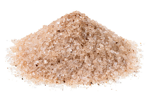 Heap of cinnamon sugar isolated on white.