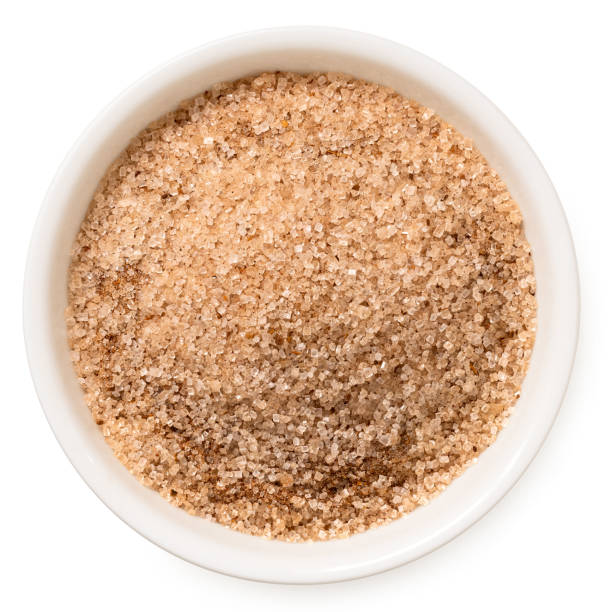 istock Cinnamon sugar in a white ceramic bowl isolated on white from above. 2111664738