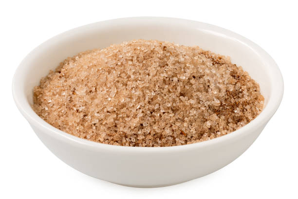 istock Cinnamon sugar in a white ceramic bowl isolated on white. 2111665800