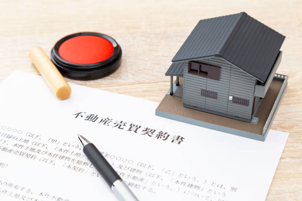 istock A house model and a contract are on the desk. 2111677119