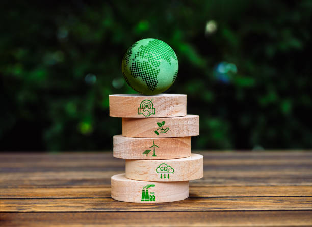 istock Green life sustainability, environment responsibility concept. 3d Green earth globe on top of round wood block stack with cooperation, carbon reduction and renewable energy icon, on leaves background. 2111679192
