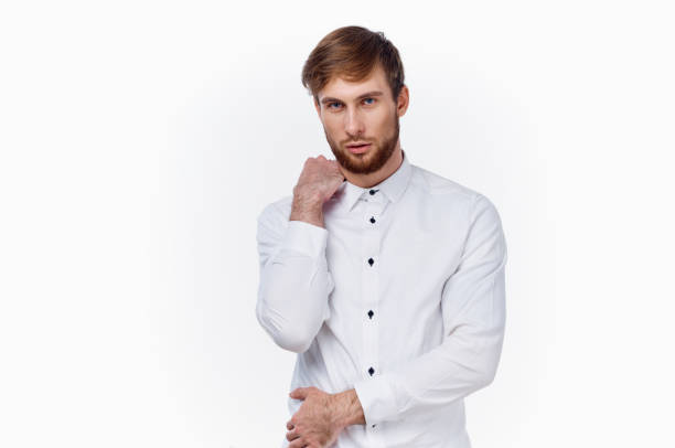 business man in white shirt gesturing with hands on light background cropped view. High quality photo