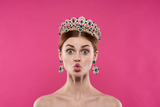 beautiful woman with a crown on her head makeup decoration Studio Model. High quality photo