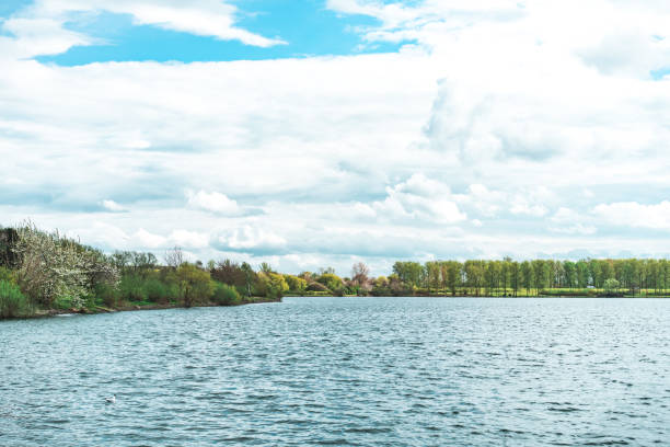 Willen lake under cloudy sky in summer, Milton Keynes