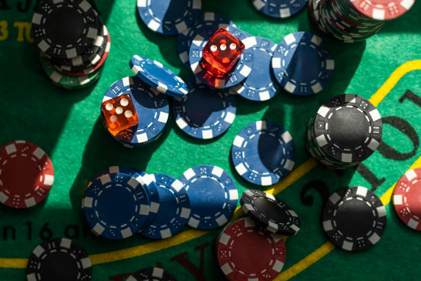 istock Gambling theme. Colorful playing chips in stacks on green table close up 2111741746