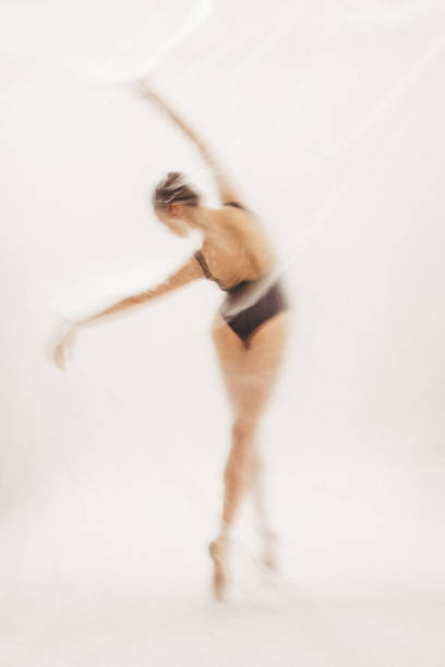 istock Beautiful ballerina dancing on the stage 2111753304
