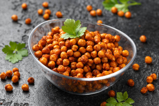 istock Roasted spicy chickpeas in bowl. Healthy snack. 2111758511