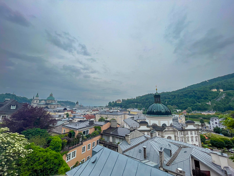 High angle view over the old Town of Salzburg, Austria during an overcast springtime day. Salzburg's historic center (German: Altstadt) is known for its typical Baroque architecture and is one of the best-preserved downtown districts north of the Alps.
