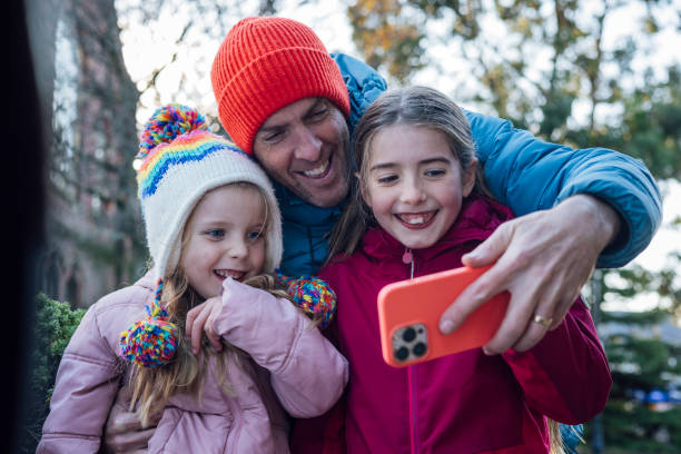 istock Selfie Session with Father and Daughters 2111773299