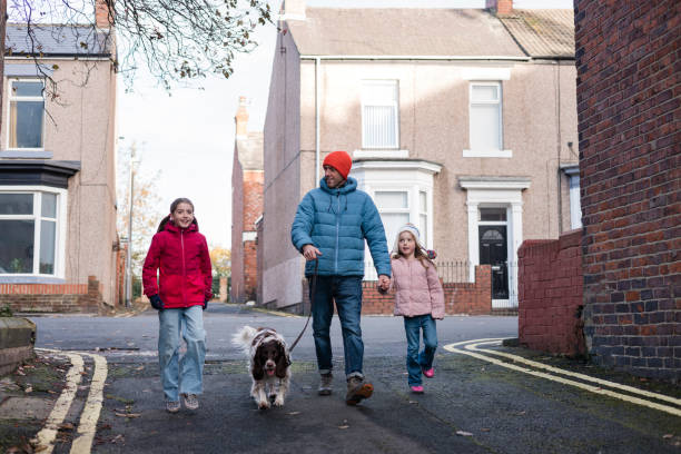 istock Family Bonding father and daughters 2111773826