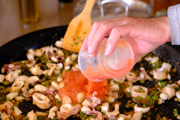 Seafood plate featuring shrimp and calamari with a blurred dining background