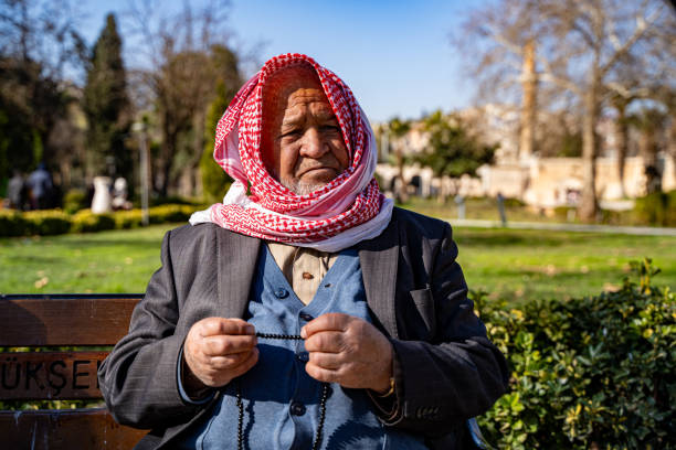 Close up Arab senior man holding prayer beads. Sanliurfa, Turkey - March 25, 2024.