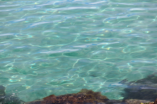 Wonderful image of rippled sea water with turquoise blue and green colors