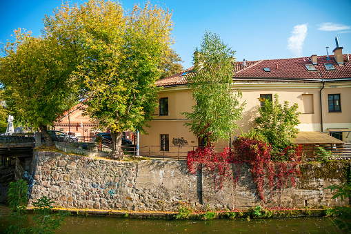 A serene view of Uzupis district in Vilnius, showcasing the natural beauty and architectural elegance that makes the city visually appealing and culturally rich