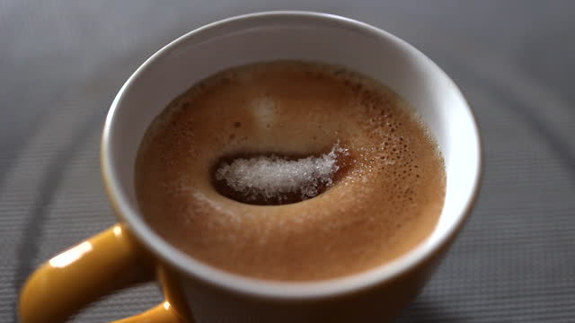 add sugar and mix a cappuccino