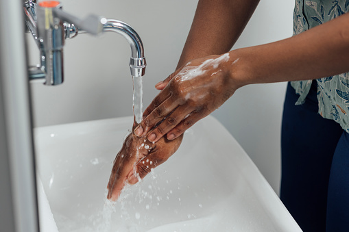 Close up of a GP washing her hands at a hospital in Newcastle Upon Tyne.