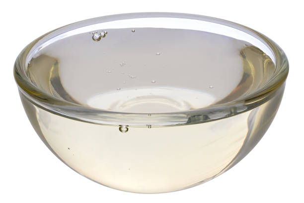 istock Rice syrup in a glass bowl isolated on white. 2111819266