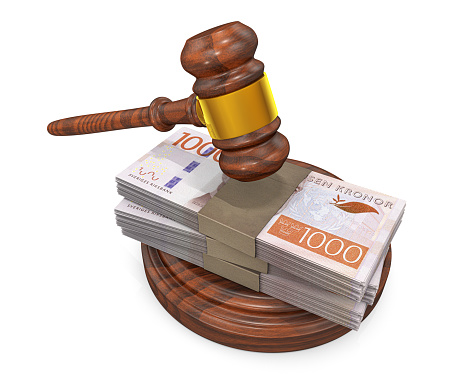 Judge gavel and stack of Swedish Kronas bills