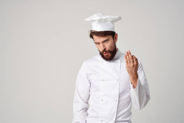 istock male cook Cooking culinary industry light background 2111879204