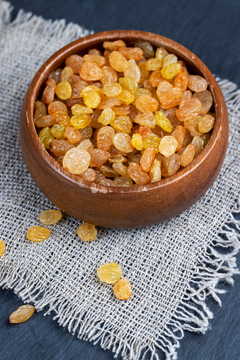 golden raisins on the kitchen table, sweet yellow raisins from grapes