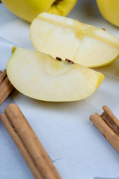 Apples with spices: cinnamon, star anise on plate isolated on white background. Top view