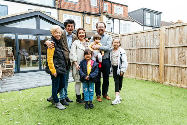 istock British Asian multi generation family posing in backyard 2111889330