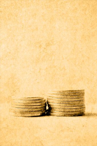Vector illustration of two stacks or Heaps of traced money or pile of old faded distressed golden colored currency coins arranged as mountain or set  of abundant money over antique beige coloured vintage classic style vertical background with copy space