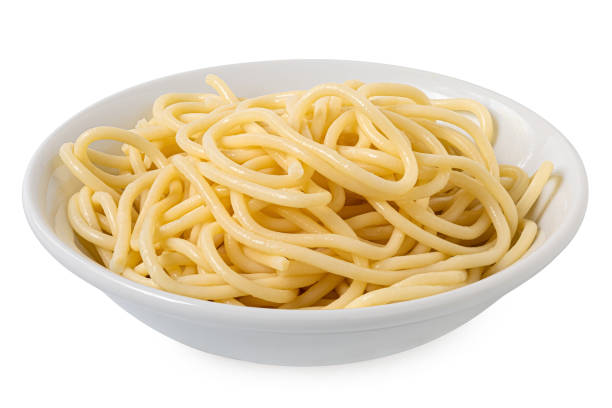 istock Cooked spaghetti in a white ceramic bowl isolated on white. 2111928511
