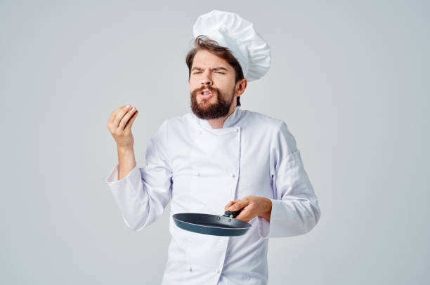 istock male cook pan cooking kitchen culinary industry 2111929563
