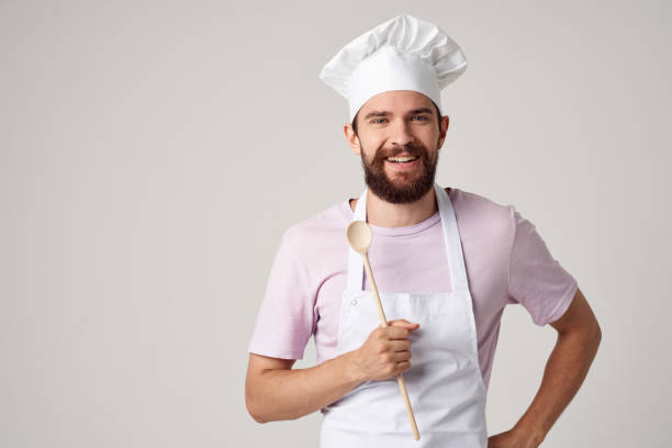 istock male baker with fresh bread in his hands cooking baking 2111931721