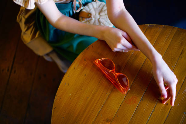 istock woman sitting in a cafe glasses on the table rest 2111949752