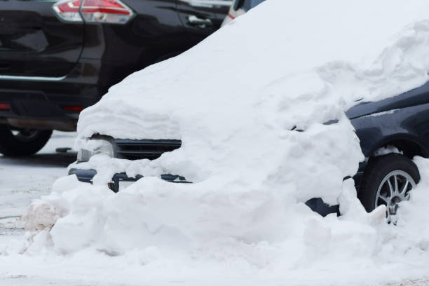 istock Car, blanketed in a thick layer of snow 2111953432