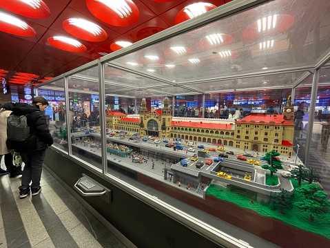 Prague, Czech Republic - March 06, 2024: Colorful model of a toy train station with small figures and details.