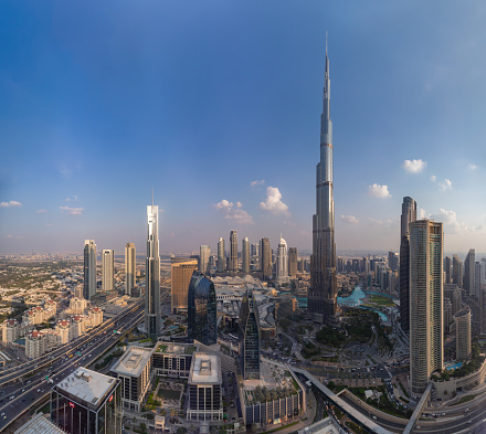 Dubai, United Arab Emirates - November 6, 2023: A picture of the Burj Khalifa towering over the buildings of the nearby Downtown Dubai, Business Bay, and Zabeel 2 districts.