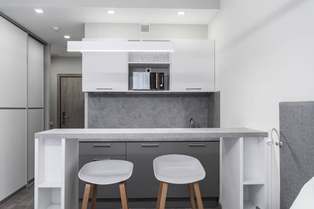 istock kitchen table and two white chairs, kitchen furniture and appliances in the background 2112010901