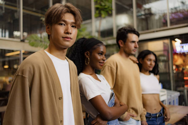 istock Young Chinese man beside his friends. 2112017792