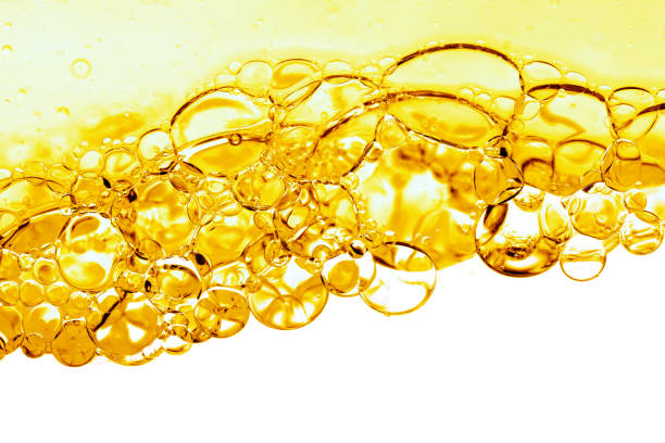 istock Hydrophilic oil close-up, bubbles in the yellow liquid 2112034668