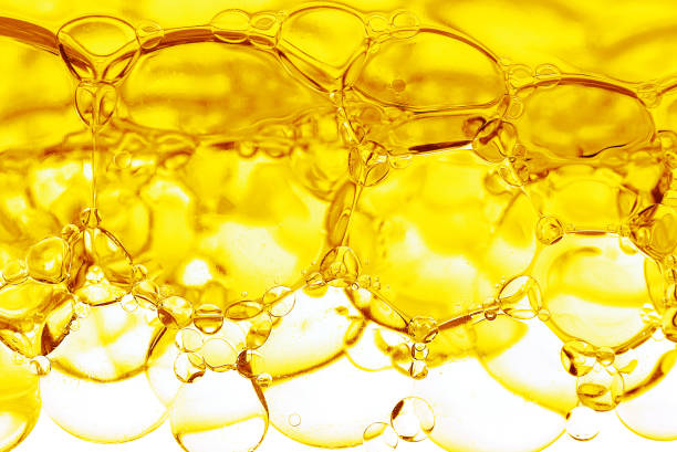 istock Transparent yellow bubbles in liquid. Cosmetic essence, serum 2112034671