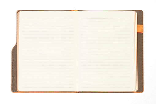 Orange Note Book Over White Background