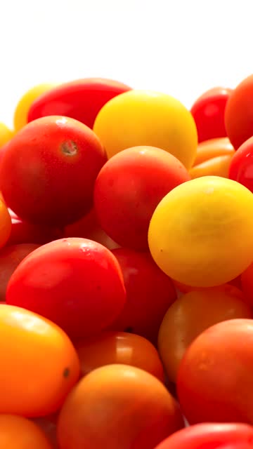 red and yellow cherry tomatoes, rotation in circle. tomato, Turning. selective focus.