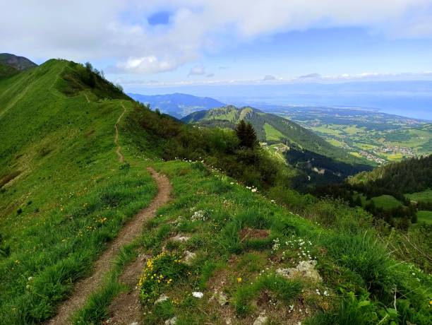 istock Over the crest, hiking in vertiginous landscape 2112051698