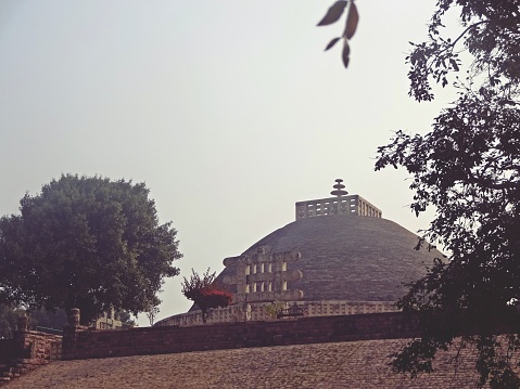 Sanchi Stupa is a Buddhist complex, famous for its Great Stupa, on a hilltop at Sanchi Town in Raisen District of the State of Madhya Pradesh, India. It is located, about 23 kilometers from Raisen town, district headquarter and 46 kilometres north-east of Bhopal, capital of Madhya Pradesh.