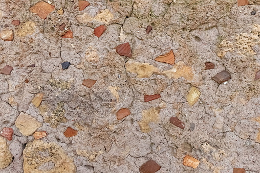 Close-Up Texture Of Weathered Concrete Wall With Embedded Stone Chips Neutral Tone Background