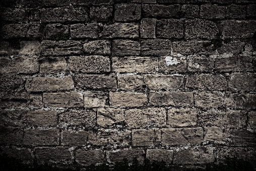 Ancient Stone Brick Wall Texture With Weathered Blocks And Dark Mossy Surface Full Frame Background