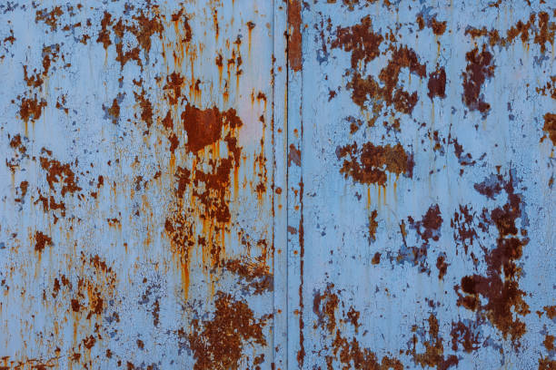 faded blue paint on flat sheet steel surface with stains of rust - full-frame background and texture - seam horizontal full frame outdoors fotografías e imágenes de stock